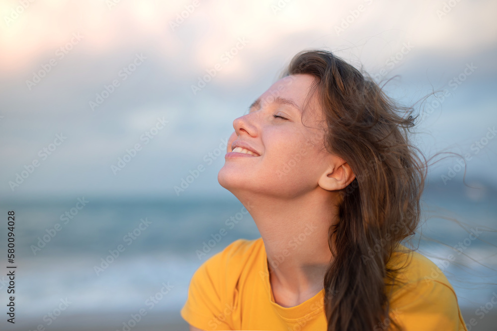 Portrait of happy girl, young carefree woman enjoying summer vacation on sea, walking on beach sand, smiling and having fun in tropical country, relaxing on nature. Summertime, happiness concept. Portrait of happy girl, young carefree woman enjoying summer vacation on sea, walking on beach sand, smiling and having fun in tropical country, relaxing on nature. Summertime, happiness concept.