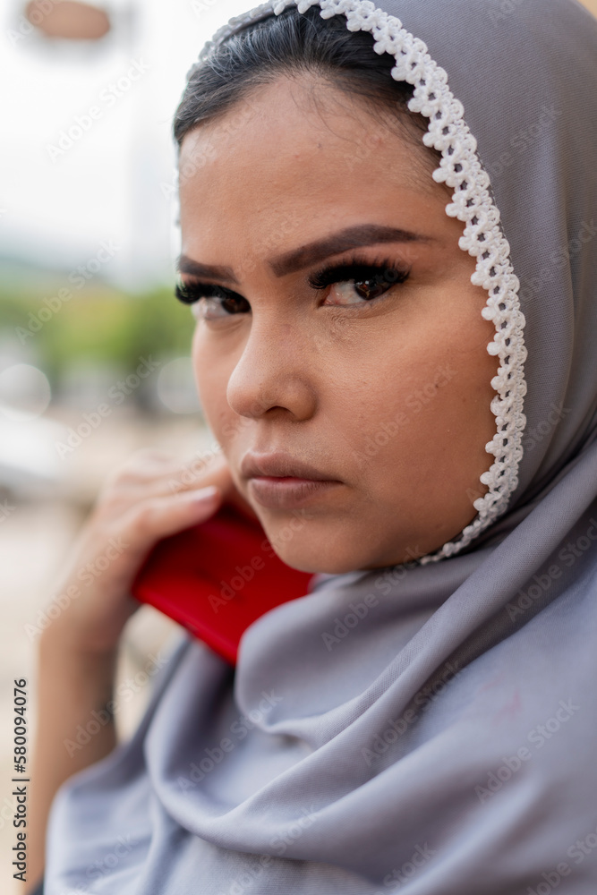 beautiful woman with islamic features, enjoying the day, walking through the streets and taking a picture of herself, woman with hijab beautiful woman with islamic features, enjoying the day, walking through the streets and taking a picture of herself, woman with hijab