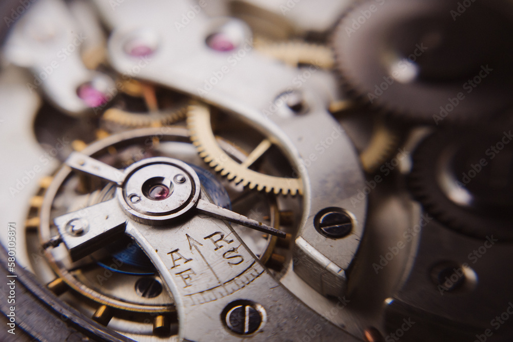 macro shot of details of an old Swiss watch, small gears, springs and clock mechanism close-up macro shot of details of an old Swiss watch, small gears, springs and clock mechanism close-up