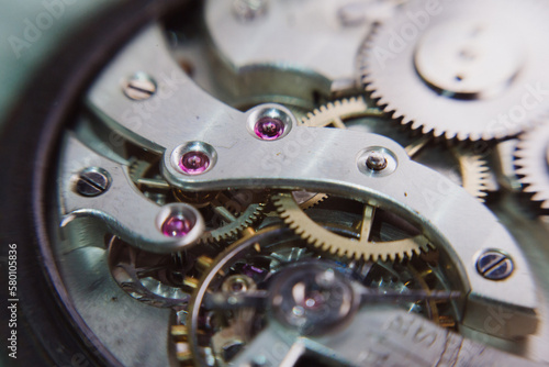 macro shot of details of an old Swiss watch, small gears, springs and clock mechanism close-up