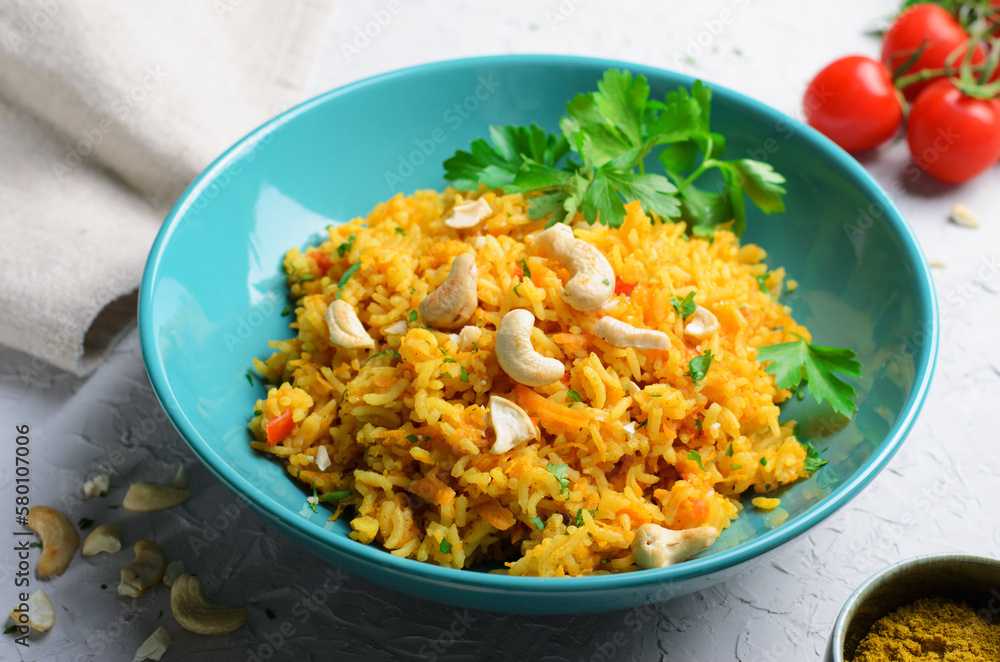 Yellow Turmeric Rice with Vegetables on Bright Background Yellow Turmeric Rice with Vegetables on Bright Background