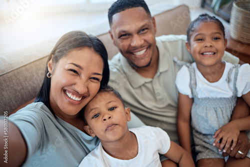 Happy family, selfie and home portrait of a mother, father and children with a smile. Black family, mom and man together with love, parent care and bonding on a sofa with morning happiness and hug