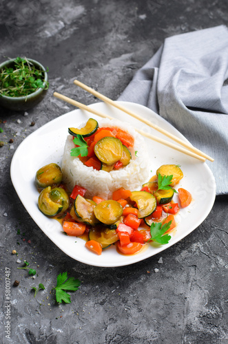 Rice with Vegetables Asian Style, Vegetarian Meal on Dark Background