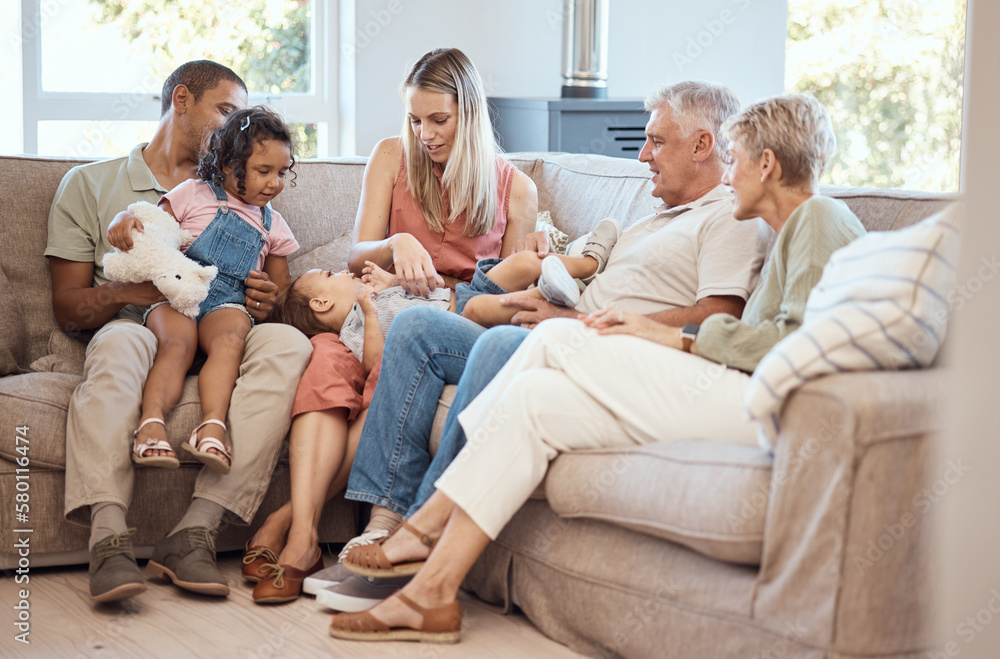 Love, children with grandparents in a big family as mother and father play with kids on the sofa or couch. Dad mom and young kids happy to enjoy bonding with lovely grandmother and senior man in home