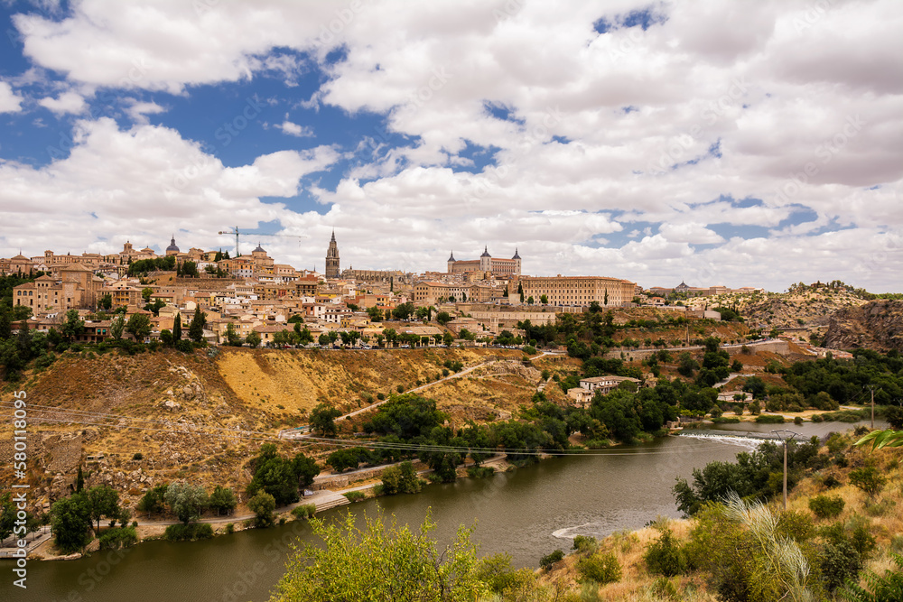 Skyline of the old city of Toledo on the hill where the Old Cathedral and the Alcazar stand embraced by the Tagus River