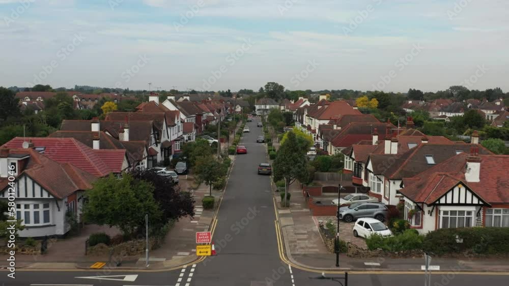reveal shot british house with empty road in united kingdom suburbs neighborhood reveal shot british house with empty road in united kingdom suburbs neighborhood