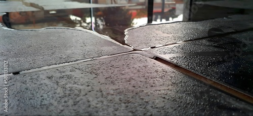 Photography Puddle of water on the floor due to leakage