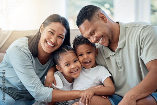 Happy, love and family portrait with kids, parents and relax on a sofa with a smile in the living room. Happiness, care and mom with dad sitting and holding children with joy on a couch in home.
