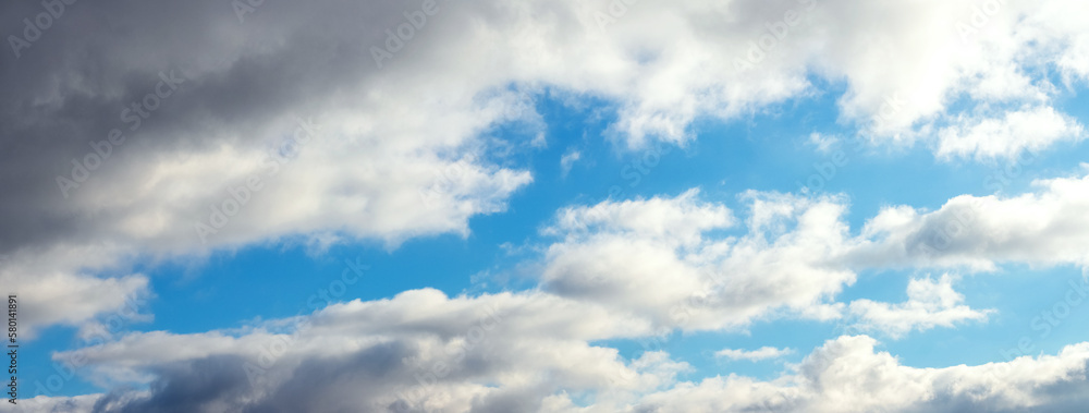 White curly clouds in the blue sky, panorama White curly clouds in the blue sky, panorama