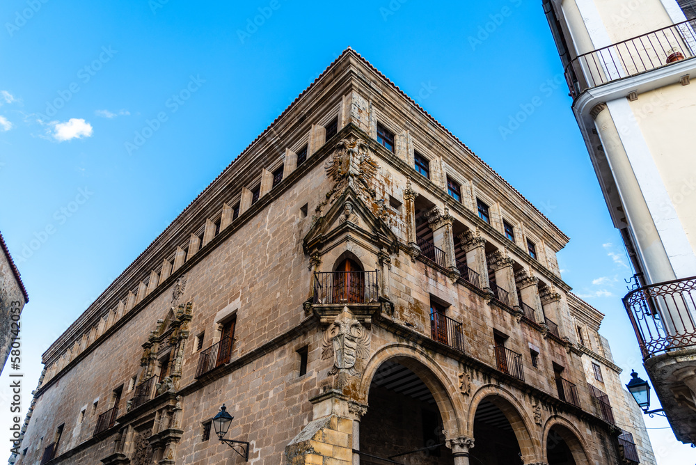 The Palacio de los Duques de San Carlos is a 16th century renaissance palacio in Trujillo, a town in the Spanish region of Extremadura. It features a corner balcony, seen here in the middle of the pic