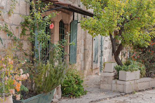 Potted plants on the streets near old house in Yemin Moshe district, Jerusalem, Israel