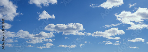 Beautiful white clouds in blue sky. Cumulus clouds © Olga Iljinich