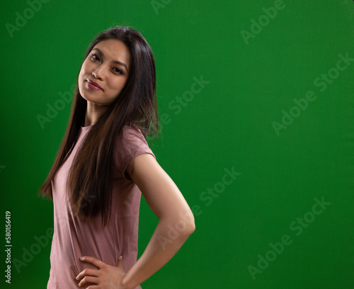 Young Asian woman with a beautiful face - portrait shot against color background. High quality photo © 4kclips