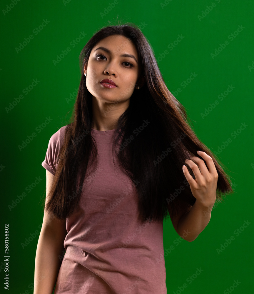 Young Asian woman with a beautiful face - portrait shot against color background. High quality photo Young Asian woman with a beautiful face - portrait shot against color background. High quality photo