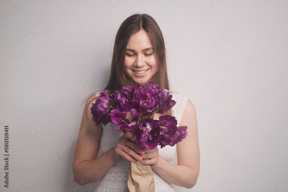 girl with tulips on a white background girl with tulips on a white background