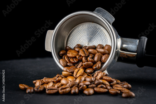 Wallpaper Mural Porta filter with black shiny Handle. view with coffee beans. Barman tool for making an espresso with the right pressure. Torontodigital.ca