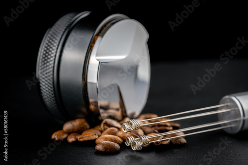 Wallpaper Mural Coffee leveler with black matte texture and shiny bottom. Barista tool for leveling ground coffee in the porta filter before extraction. Torontodigital.ca