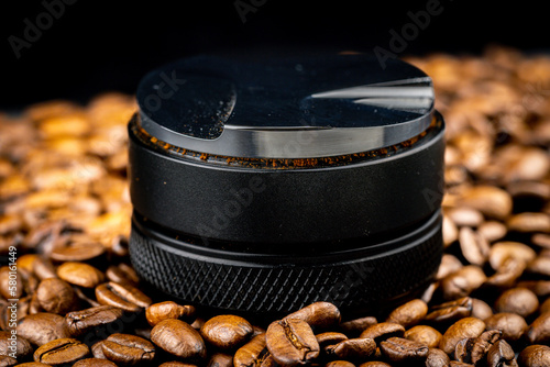 Wallpaper Mural Coffee leveler with black matte texture and shiny bottom. Barista tool for leveling ground coffee in the porta filter before extraction. Torontodigital.ca