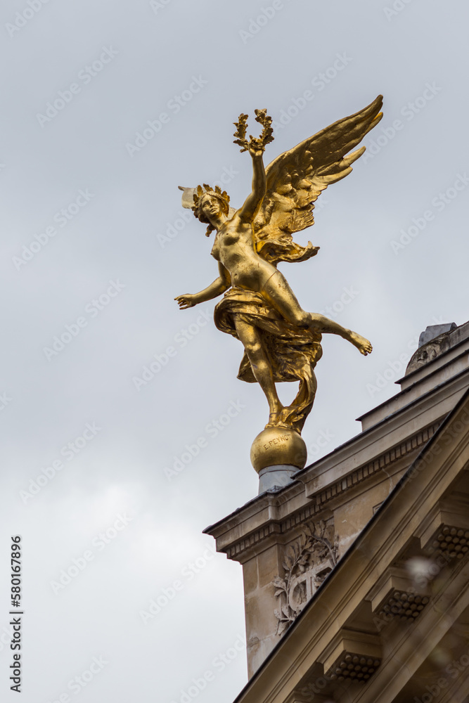 angel statue in front of the church