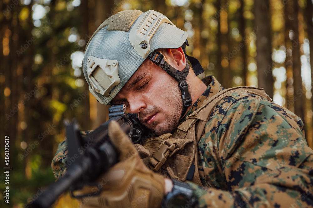 A modern warfare soldier on war duty in dense and dangerous forest areas. Dangerous military rescue operations A modern warfare soldier on war duty in dense and dangerous forest areas. Dangerous military rescue operations