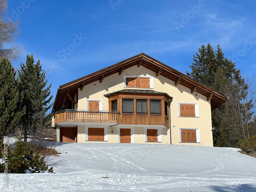 Swiss alpine holiday homes, mountain villas and holiday apartments in the winter ambience of the tourist resorts of Valbella and Lenzerheide in the Swiss Alps - Canton of Grisons, Switzerland (Schweiz