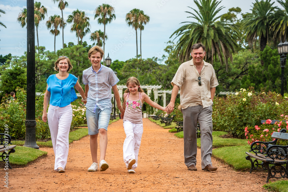 Fototapeta premium happy family relaxing in the park