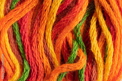 Bild auf Leinwand A close up view of shades of orange threads provides inspiration for arts and craft projects