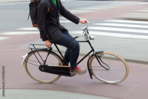 man riding a bicycle on a city street