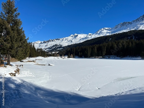 A typical winter idyll on the frozen and snow-covered alpine lake Heidsee (Igl Lai) in the Swiss winter resorts of Valbella and Lenzerheide - Canton of Grisons, Switzerland (Schweiz) © Mario