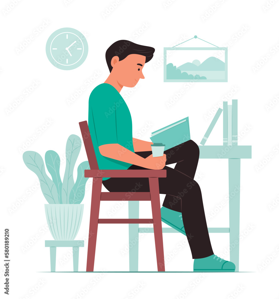 Young Man Reading a Book in Reading Room Young Man Reading a Book in Reading Room