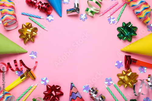 Flat lay composition with party items on pink background, space for text. Birthday celebration