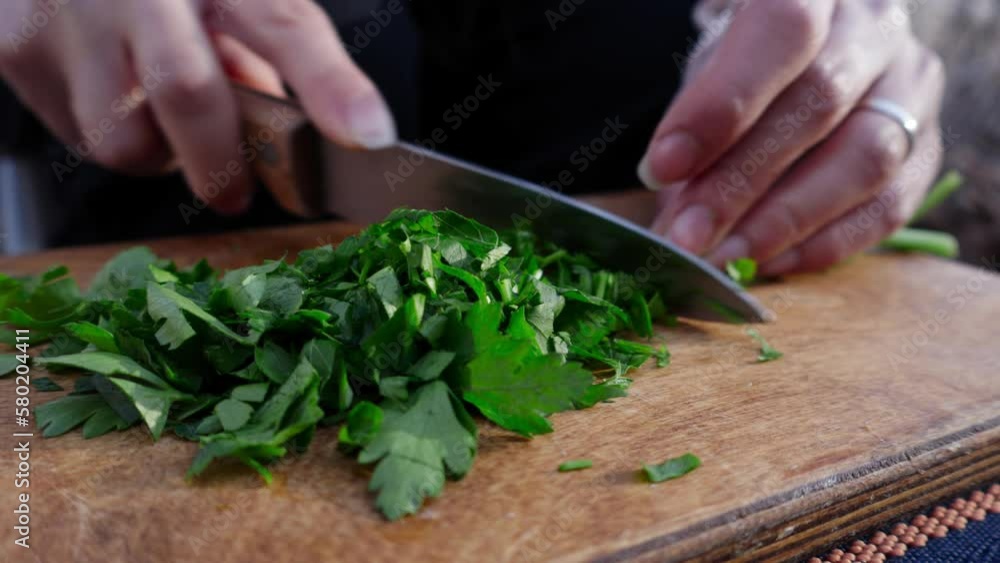 Chopping coriander greens close-up in nature Chopping coriander greens close-up in nature