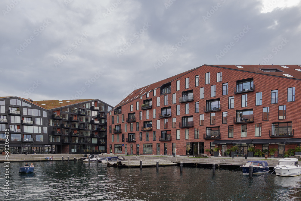Outdoor exterior view of modern design apartment and residential building on the waterside in Copenhagen, Denmark. 