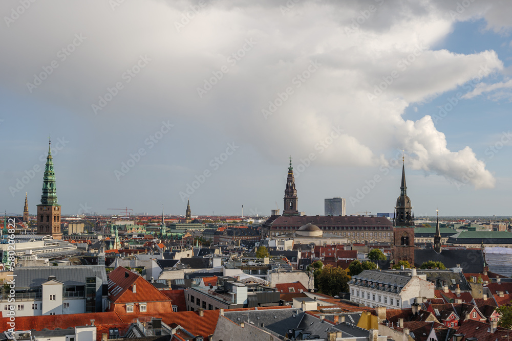 Aerial panoramic outdoor scenery view over Copenhagen, Denmark after raining with background of rainbow. 
