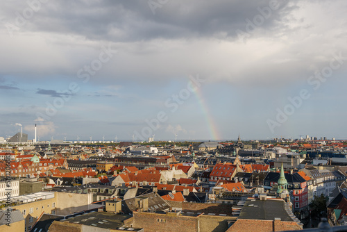 Aerial panoramic outdoor scenery view over Copenhagen, Denmark after raining with background of rainbow. 