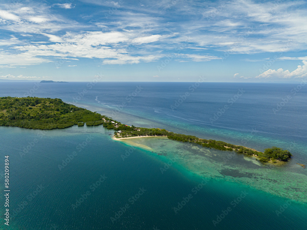 Aerial view of tropical island coastline and blue sea. Ocean and blue sky. Turtle Islands, Negros, Philippines