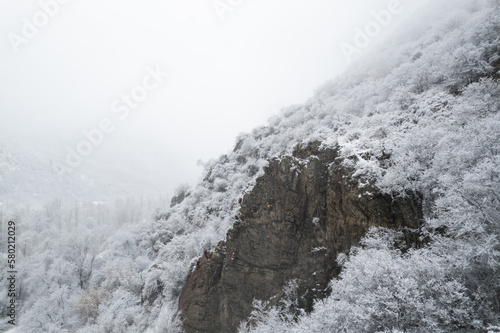 Wallpaper Mural Aerial shot of snow covered cliffs conquered by climbers Torontodigital.ca