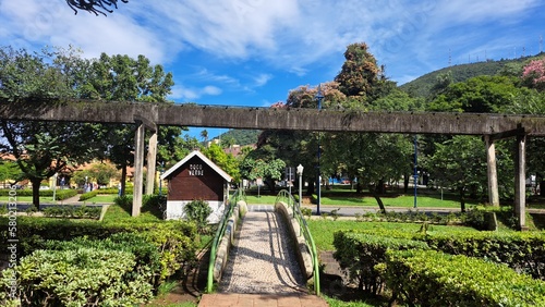 Poços de Caldas, Minas Gerais, Brazil - February 26, 2023. Bridge that leads to the main avenue where the monorail passes and on the left a wooden.