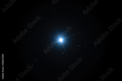 Quadro su tela Night sky background with bright Sirius star on black sky with stars