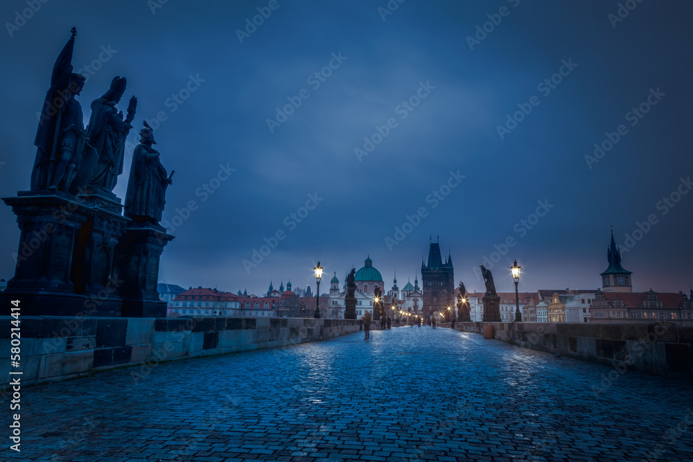 Charles Bridge, Prague at dramatic evening, Czech Republic, with night lighting