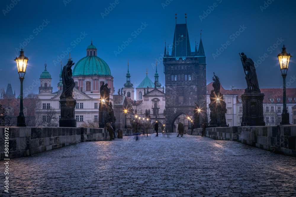 Charles Bridge, Prague at dramatic evening, Czech Republic, with night lighting