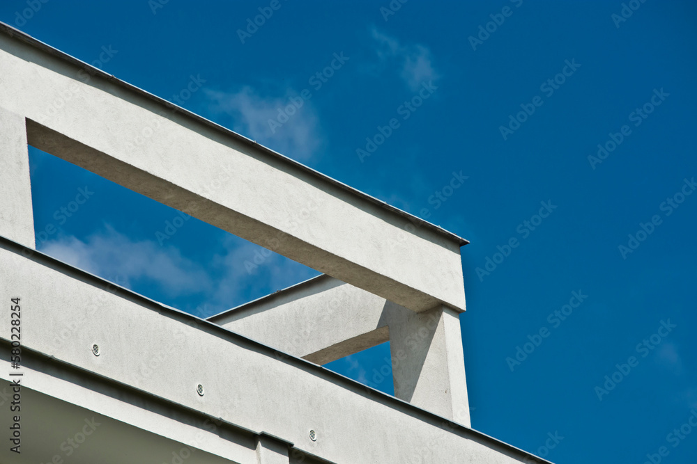 white building structure against a blue sky white building structure against a blue sky