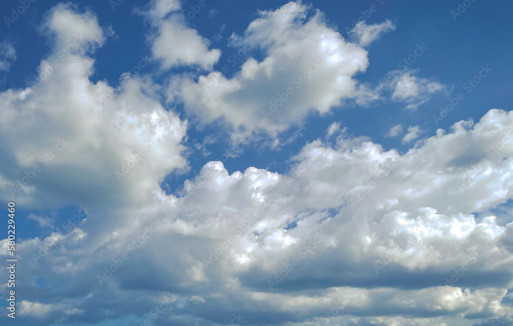 The clear sky is covered with white clouds. The clear sky is covered with white clouds.