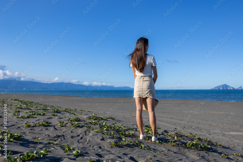 Travel woman look at the sea beach in Taiwan Yilan Travel woman look at the sea beach in Taiwan Yilan