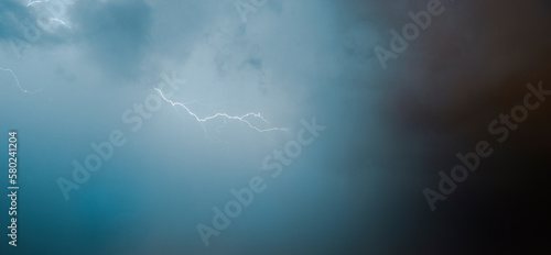 Scenic view of thunderstorm against cloudy sky photo