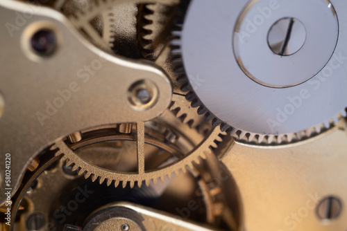 The process of repairing a mechanical watch.
Clockwork. Very shallow depth of field. Focus on the central gears