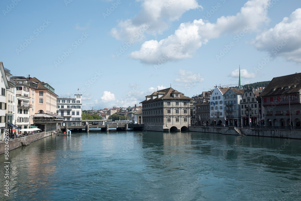 Buildings by Limmat River against sky Buildings by Limmat River against sky