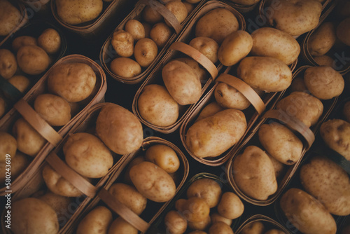 Close-up of fresh potatoes in baskets for sale at market