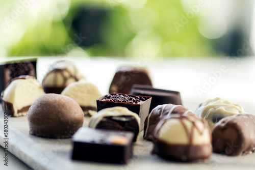 Close-up of various chocolates on table photo