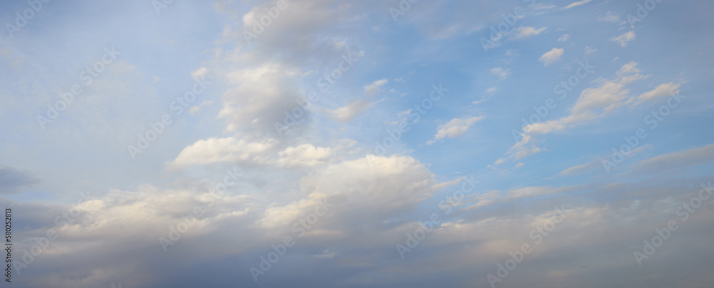 Fluffy clouds in the blue sky background